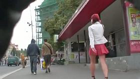 Redhead cutie followed around by an upskirt cam