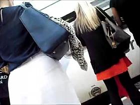 Gorgeous blonde with big round ass in tight white skirt