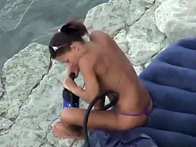 Hot girl pumping hard at the beach