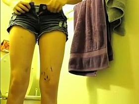 Colorful hair teen pees in bathroom