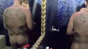 Tattooed guy bangs his sweetie in the shower