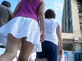 Woman upskirted in sidewalk