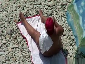 Chubby mature nudist woman with red cap