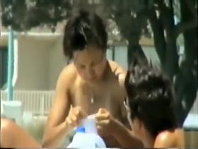 Steamy beach day with a nice natural tits girl