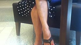 Candid Mature Feet Red Painted Toes in Flip Flops