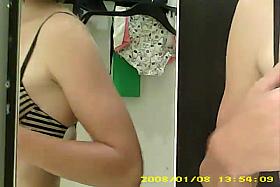 Dressing room hidden cam - Topless brunette with small boobs