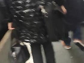 Black down jacket in street