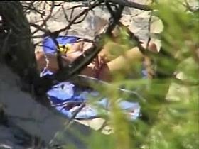 Caught a girl rubbing her pussy in nude beach