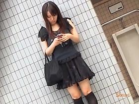 Tantalizing oriental chick messing with her phone during quick sharking scene