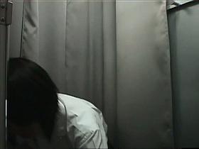 Asian teenager tries on breast-enhancing pads