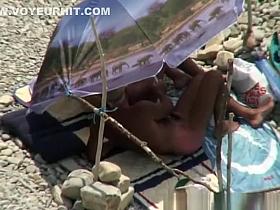 Mature nudist blonde strokes her man&rsquo;s penis