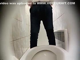 Blonde woman sits and pees