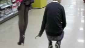 Guy take a video upskirt woman in minimarket