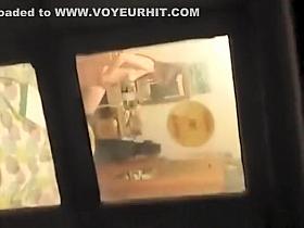 Window voyeur spies neighbor in her bedroom