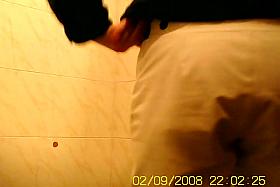 Girl in shorts pissing on toilet and getting spied on cam