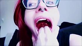 Nerdy Red-Haired Bombshell Teases The Camera With Her Sexy