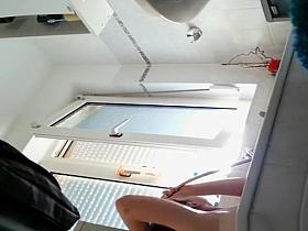 Wife spied in bathroom seated in the bathtub