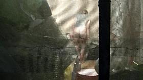 Spying through the window teen dressing