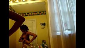 Voyeur - USA. Young black girl checks herself out.