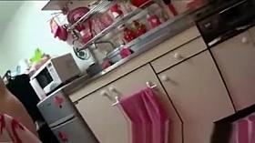 Japanese woman cleaning kitchen