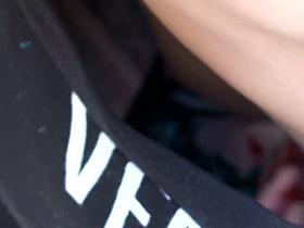 Confused Japanese girl shows her entire chest to a spy cam