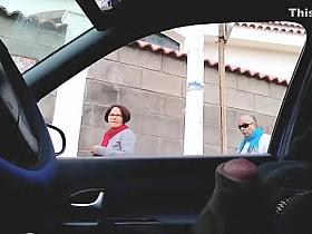 Dude plays with his cock in car