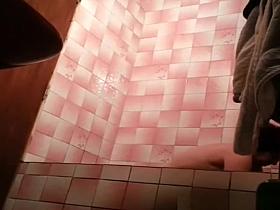 Hidden camera installed in bathroom films mature woman