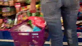 Butt & ass in blue jeans shopping