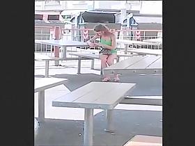 My friend's wife on her phone at the tables