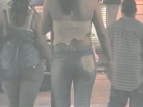 Sexy asses in jeans are filmed on a night out