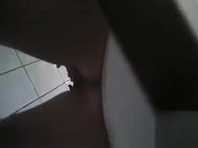 Wicked girl masturbates her pussy on the toilet seat