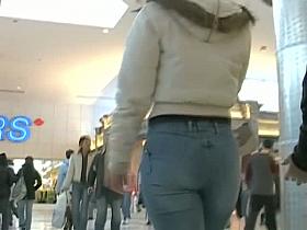 Sexy Latina girl in jeans followed by voyeur