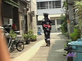 Cute Asian in a jukata has boob sharking on the street.