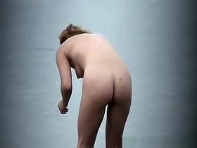 Nudist brushing teeth in beach