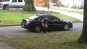 Girl caught on voyeur cam pissing on the car wheel