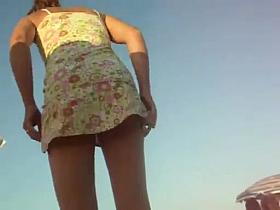 Women changing on the beach upskirt