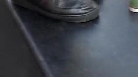 Nudist woman applies paint all over some men