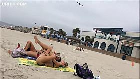 Fit blonde exercises on beach