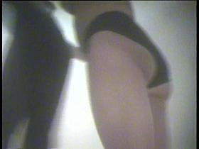 A milf teases everybody with her juisy tits in this dressing room voyeur video