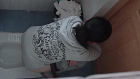 Peeing spy cam shot of a cute asian girl on a toilet