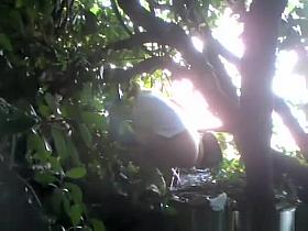 Woman caught beyond some bushes peeing