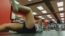 Sporty chick warms up and stretches