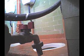 Girl in leather boots is getting spied pissing on toilet