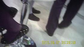 Shiny black panthose girl in super mini skirt