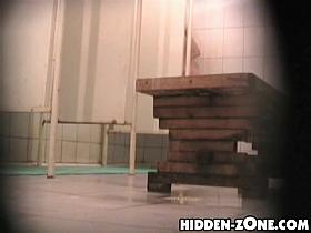 Girl hiding her nudity from kinky shower cameraman