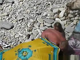 Nudist blows her standing man's penis