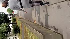 Guy cums on womans back in the street