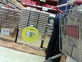 Candid supermarket worker with great ass