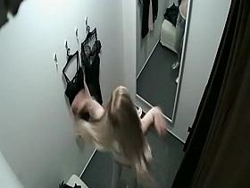 Girl with long hair in a trying booth