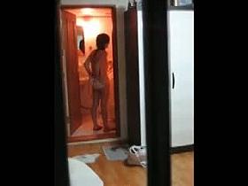 Asian babe in naked shots on hidden window cam
